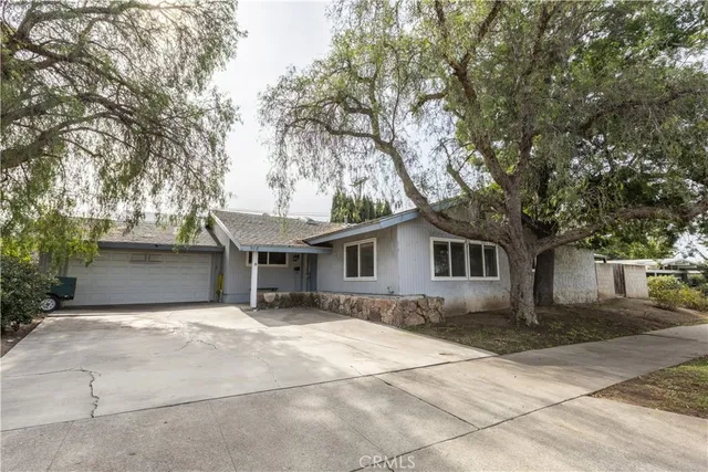a house with trees in front of it