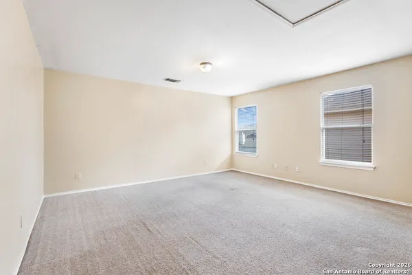 an empty room with windows