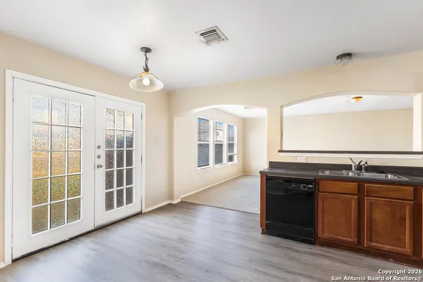 a kitchen with stainless steel appliances granite countertop a stove and a sink