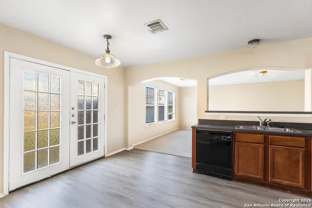 a kitchen with stainless steel appliances granite countertop a stove and a sink