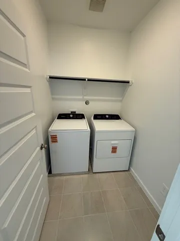 a utility room with washer and dryer