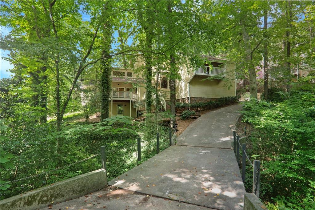 1255 Old Woodbine Road Northeast Atlanta, GA 30319 - Photo 1 of 1 a view of a pathway both side of house