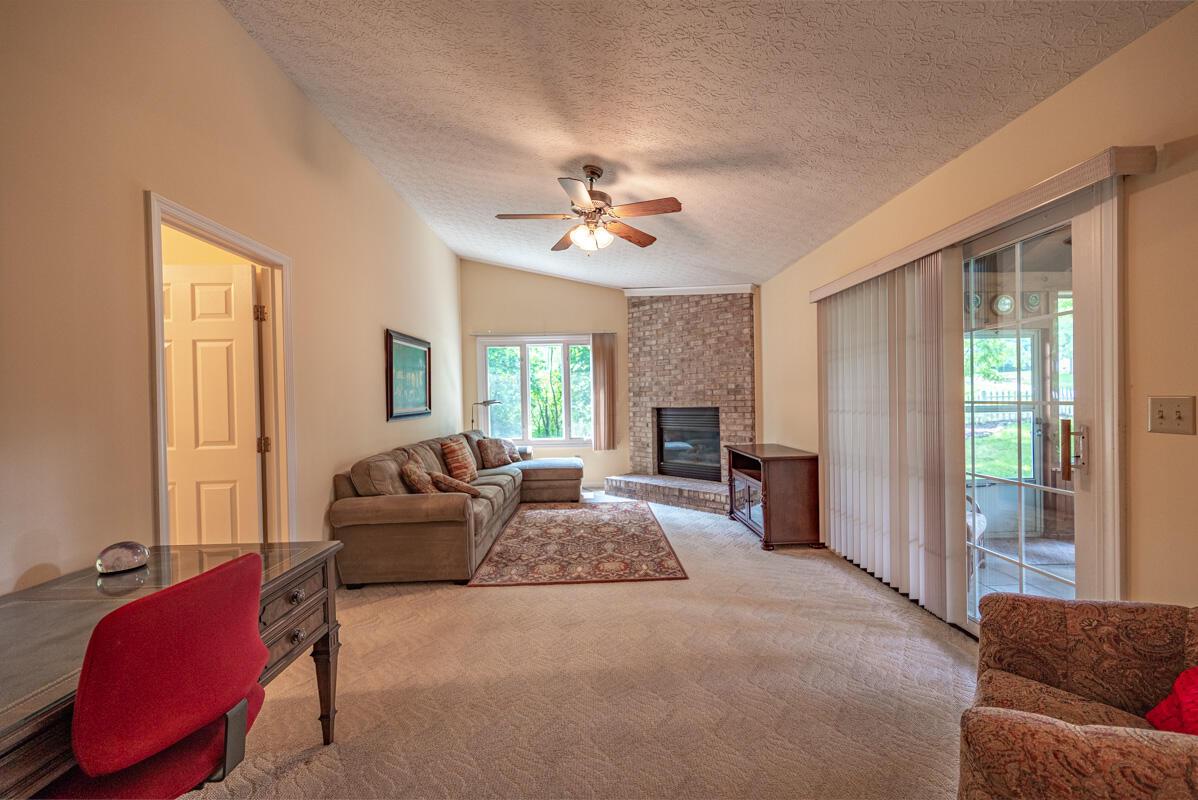 6340 Bale Kenyon Road Lewis Center, OH 43035 - Photo 7 of 41 Family room w/ fireplace & sliding doors to porch