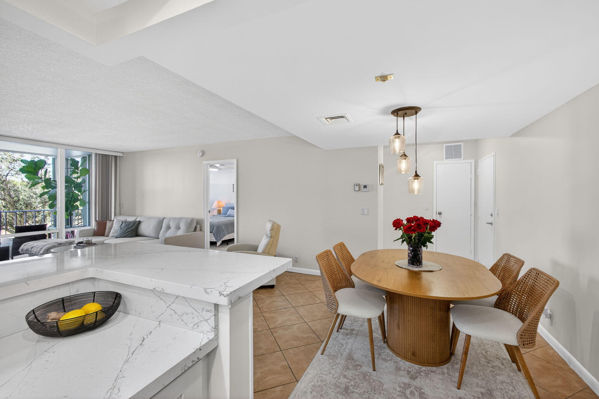336 Golfview Road, Unit 414 North Palm Beach, FL 33408 - Photo 18 of 57 a view of a dining room with furniture and a potted plant