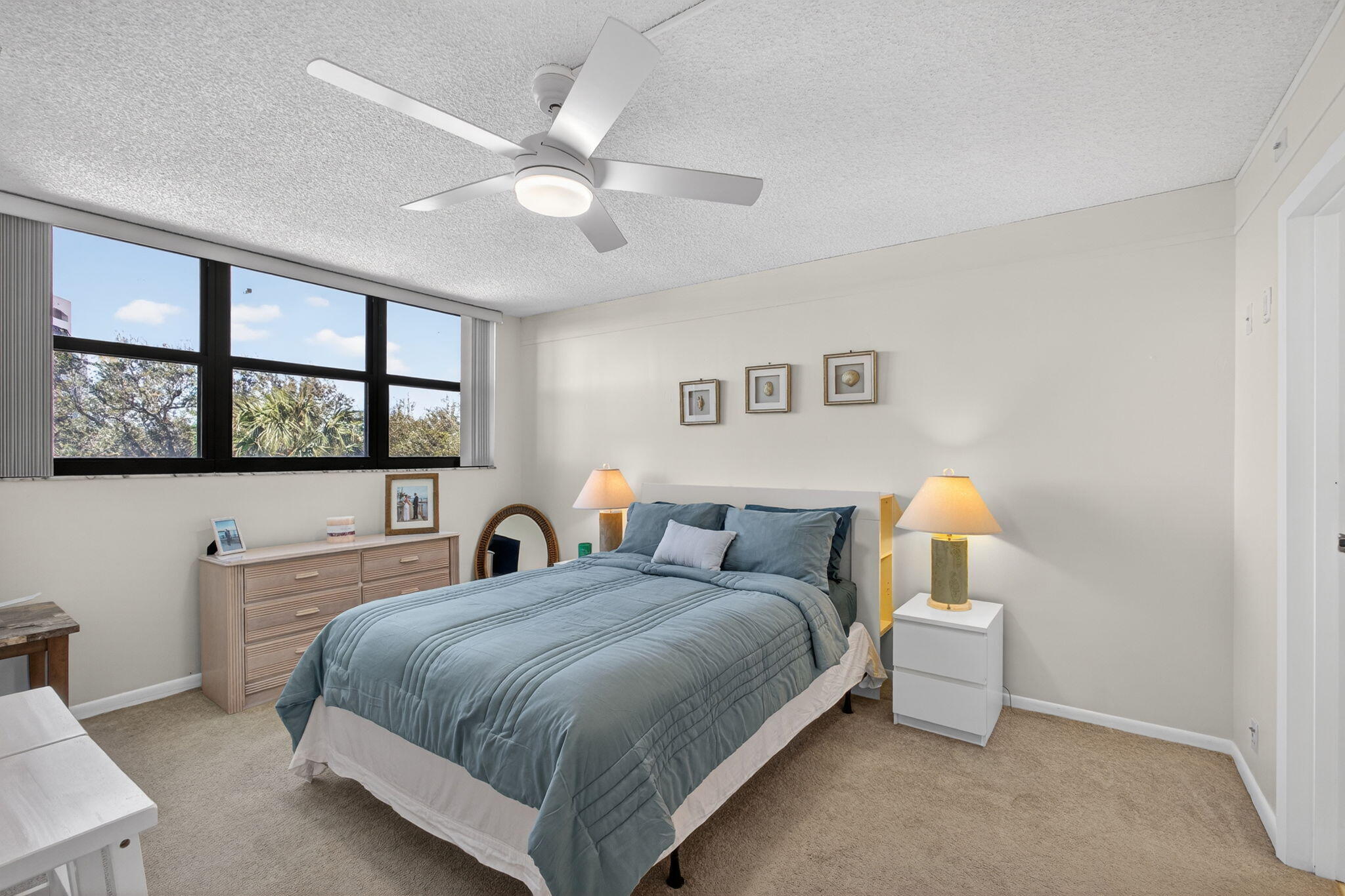 336 Golfview Road, Unit 414 North Palm Beach, FL 33408 - Photo 30 of 57 a bedroom with a bed and a large window