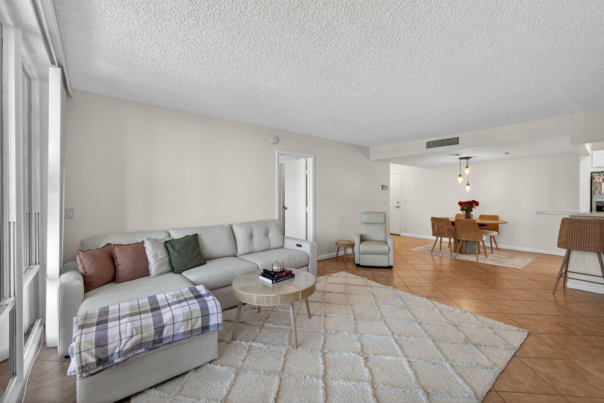 336 Golfview Road, Unit 414 North Palm Beach, FL 33408 - Photo 3 of 57 a living room with furniture and a couch