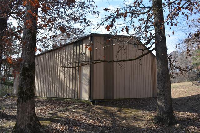 180 Taylor Road Dickson, TN 37055 - Photo 2 of 20 30x45 workshop that is heated, cooled, and insulated. Loft for storage. Walk-thru door and garage door.