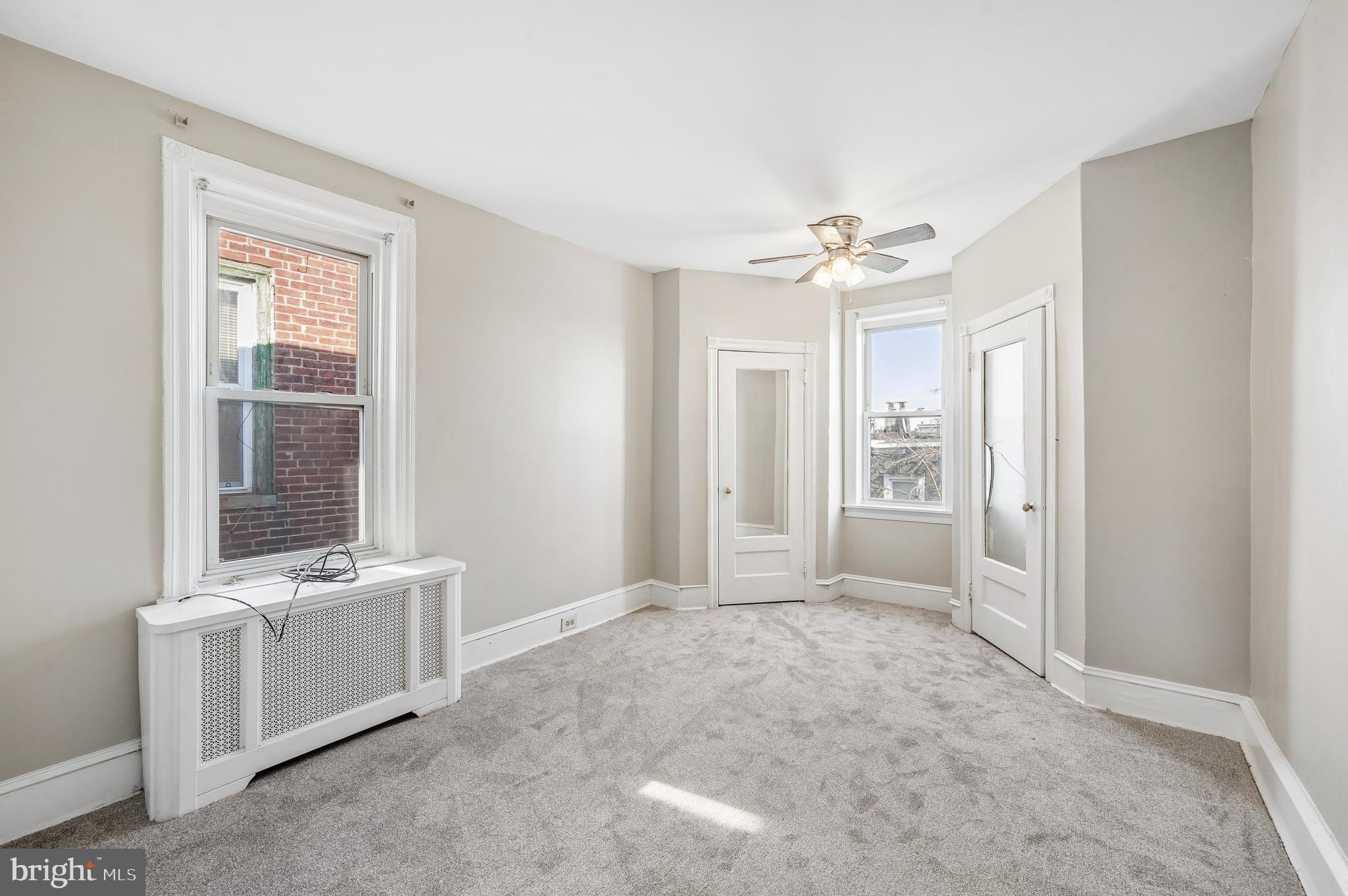 5428 Whitby Avenue Philadelphia, PA 19143 - Photo 11 of 15 a view of an empty room with a window