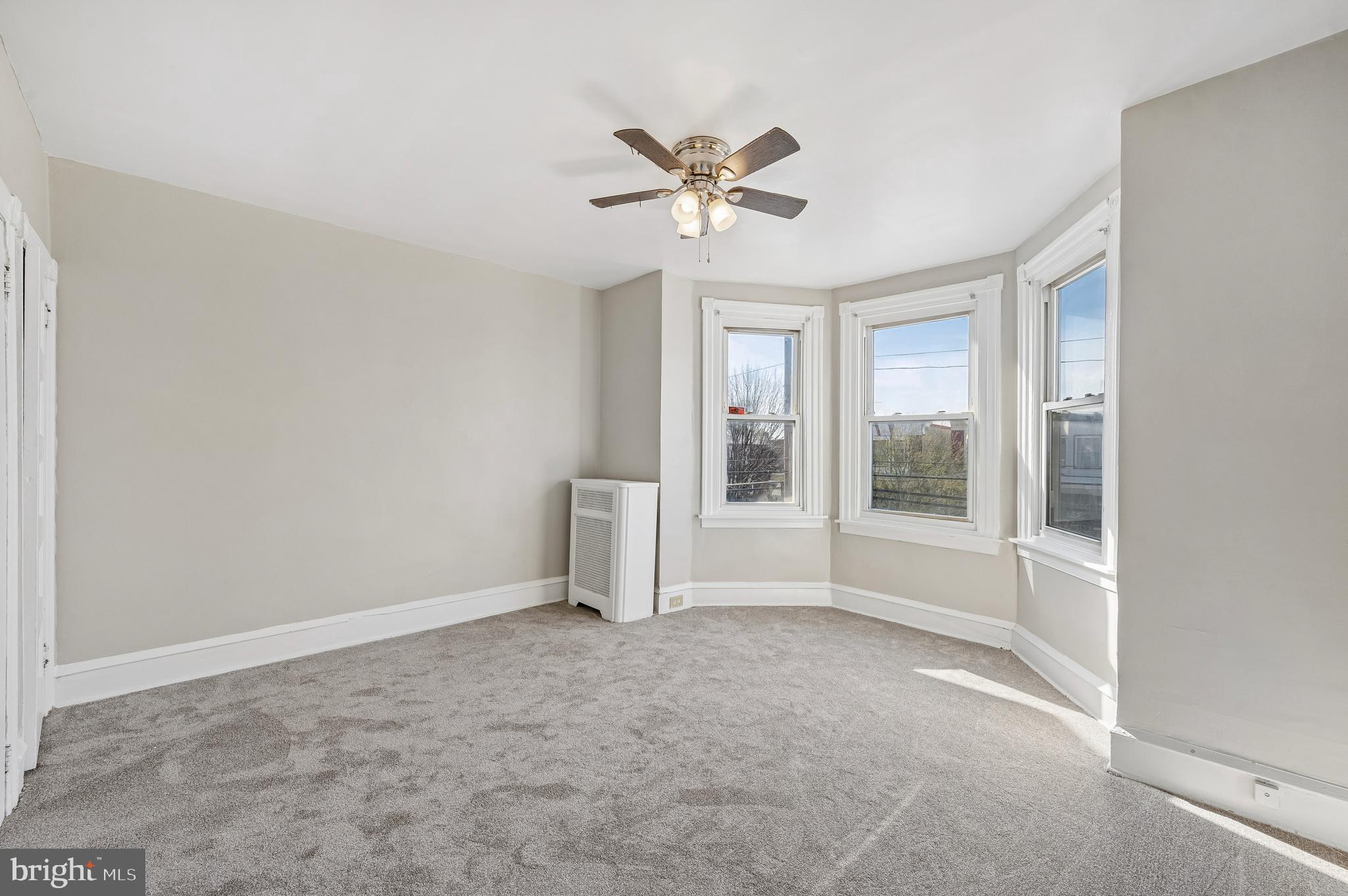 5428 Whitby Avenue Philadelphia, PA 19143 - Photo 14 of 15 a view of a livingroom with a ceiling fan and window