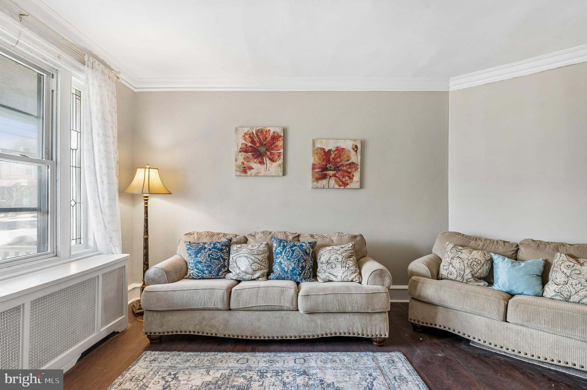 5428 Whitby Avenue Philadelphia, PA 19143 - Photo 4 of 15 a living room with furniture and a window