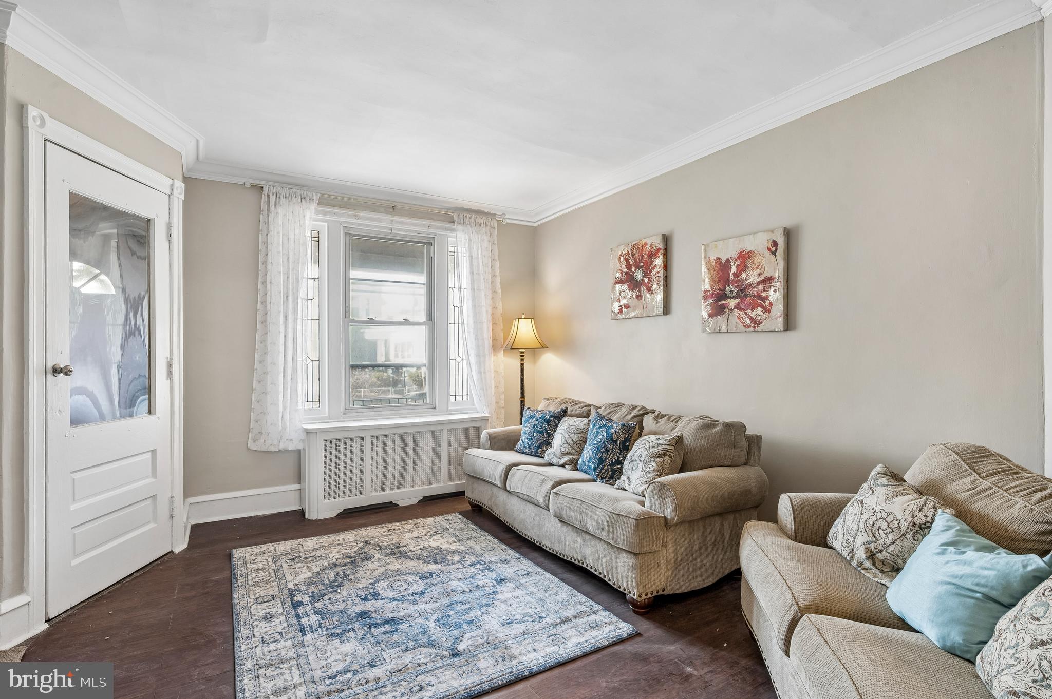 5428 Whitby Avenue Philadelphia, PA 19143 - Photo 5 of 15 a living room with furniture and a rug