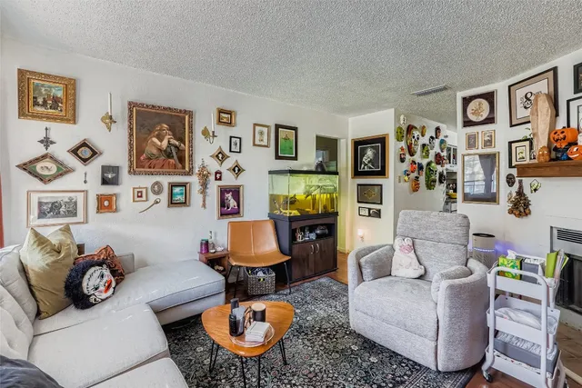 a living room with furniture kitchen and a window