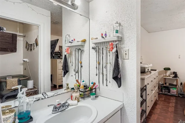 a bathroom with a double vanity sink and a mirror