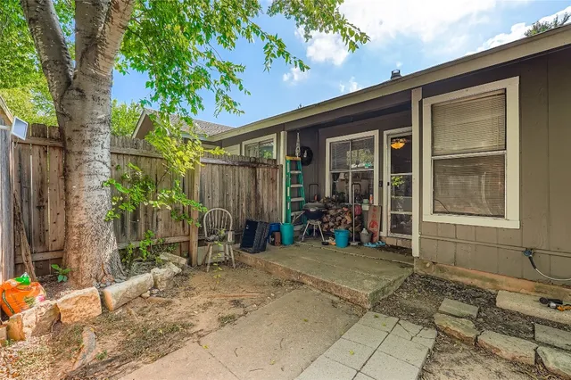 a view of house with backyard outdoor seating and shower