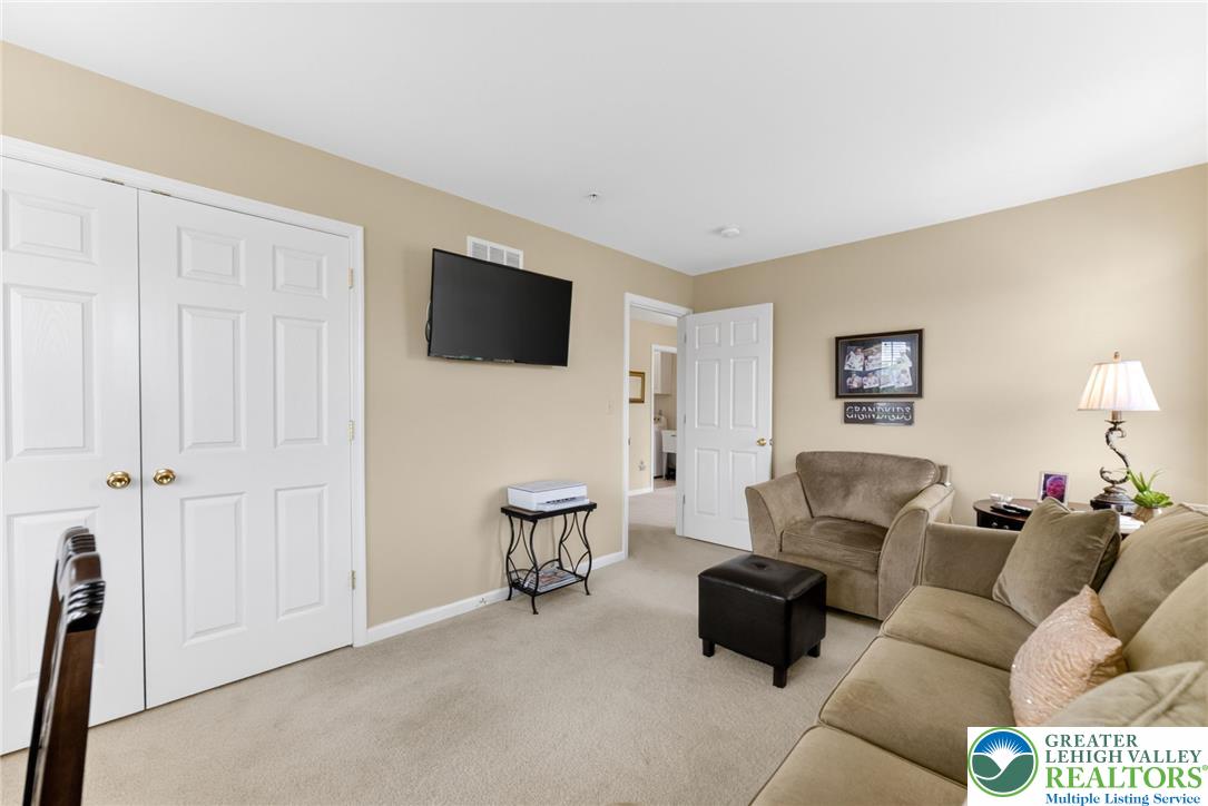 5440 Spring Ridge Drive West Macungie, PA 18062 - Photo 24 of 40 A well-lit, neutral-toned living space offers comfort and coziness for daily relaxation.