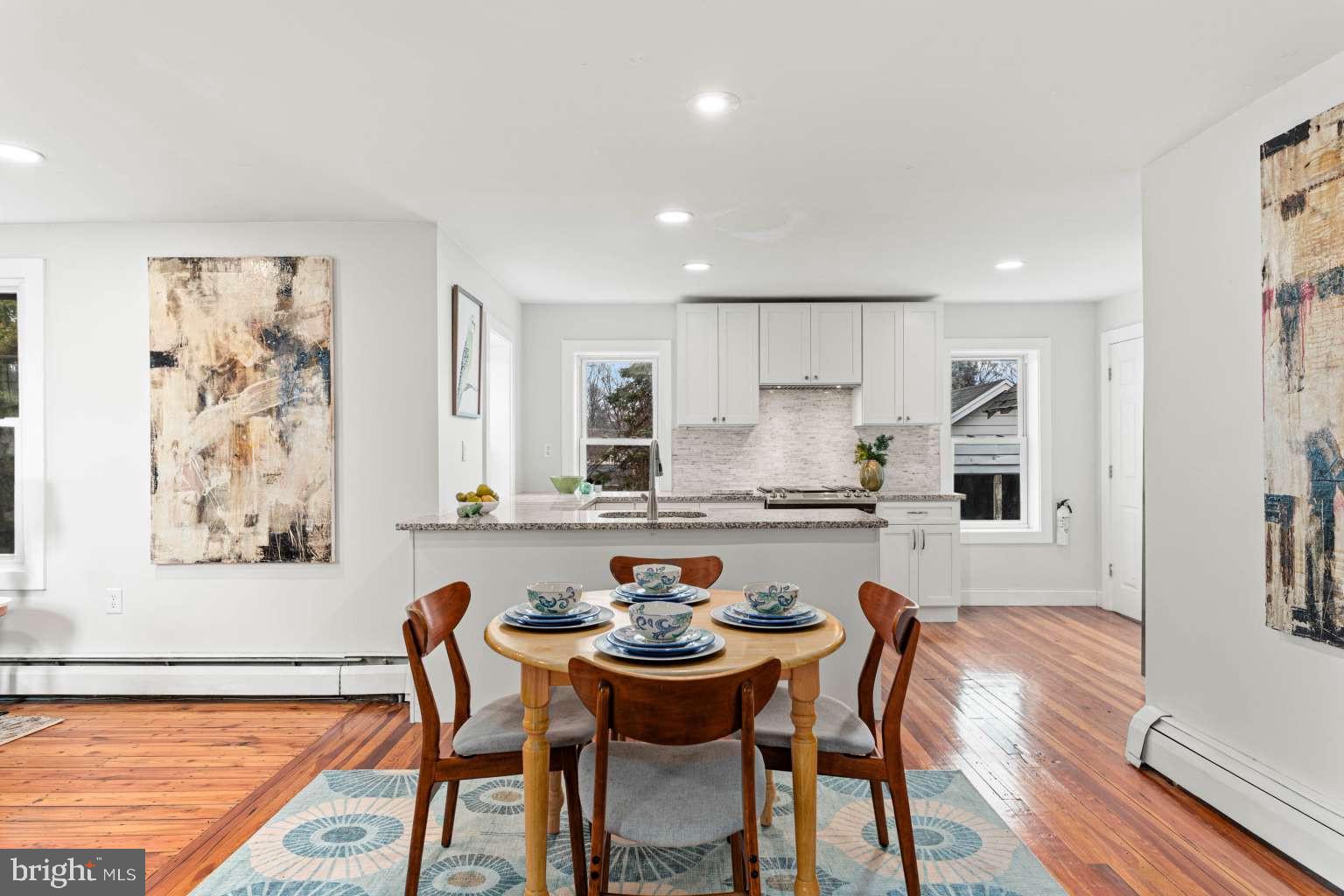 209 Willow Road Wallingford, PA 19086 - Photo 11 of 25 a kitchen with granite countertop white cabinets and stainless steel appliances