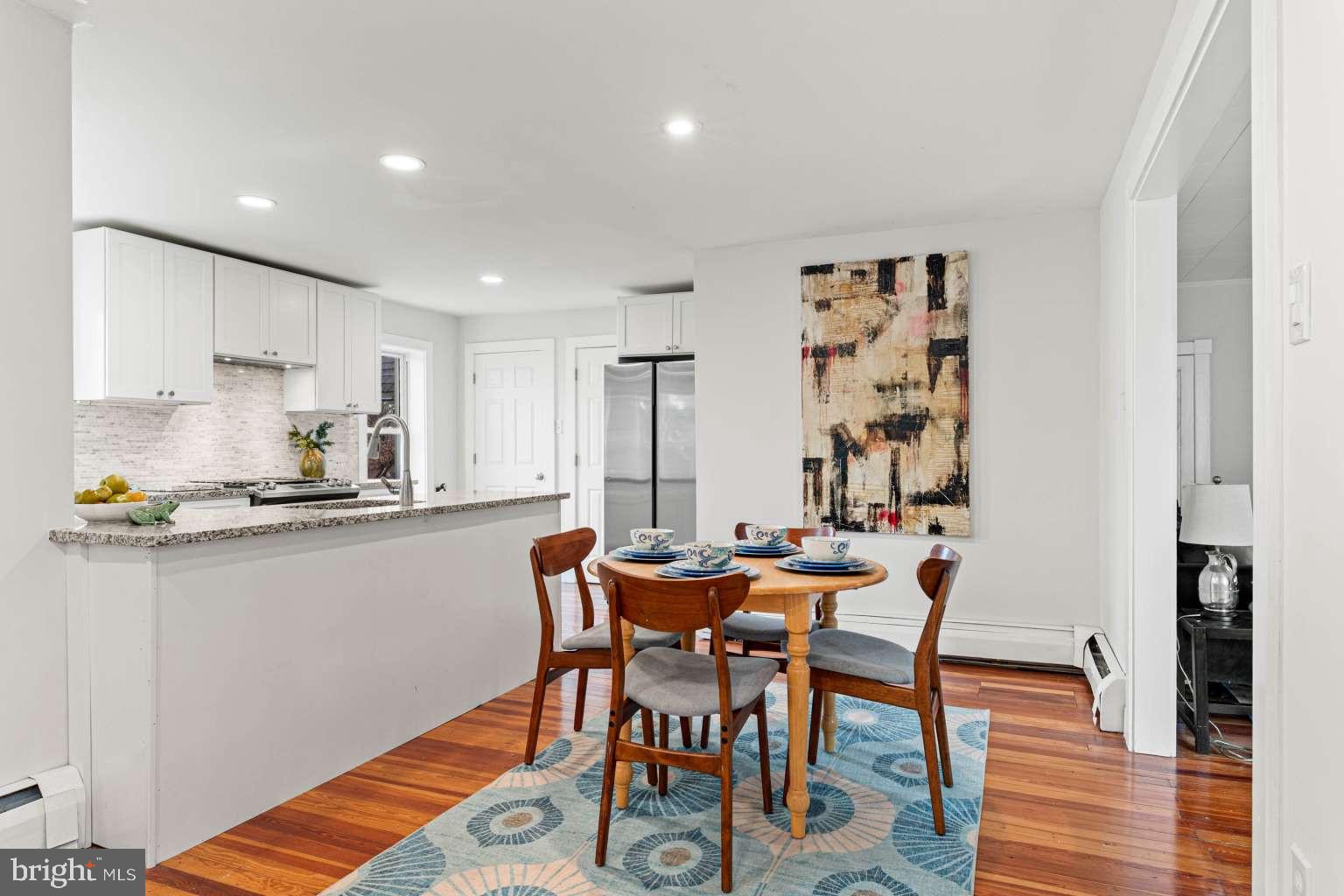 209 Willow Road Wallingford, PA 19086 - Photo 14 of 25 a dining room with furniture and wooden floor