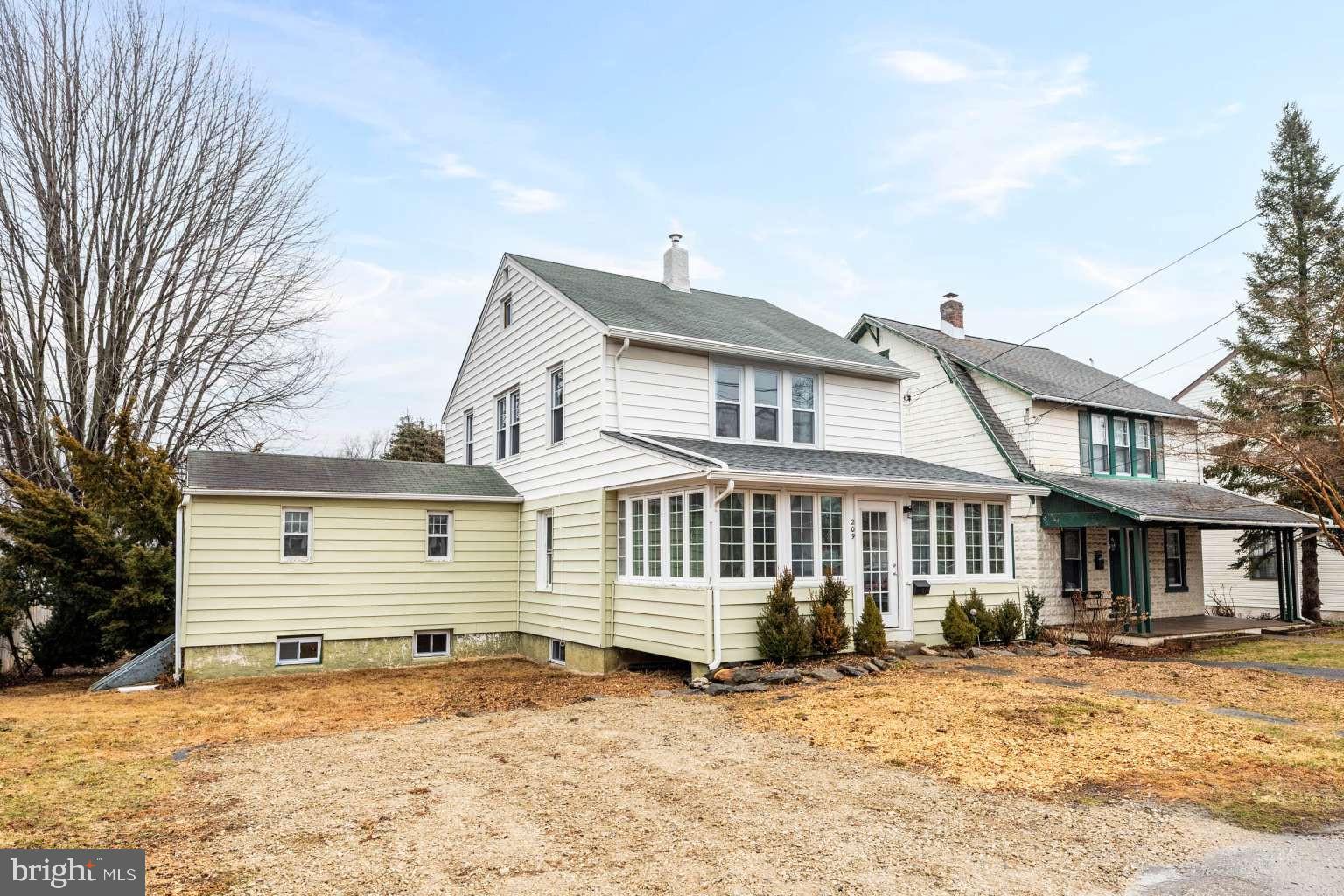 209 Willow Road Wallingford, PA 19086 - Photo 2 of 25 a front view of a house with a yard