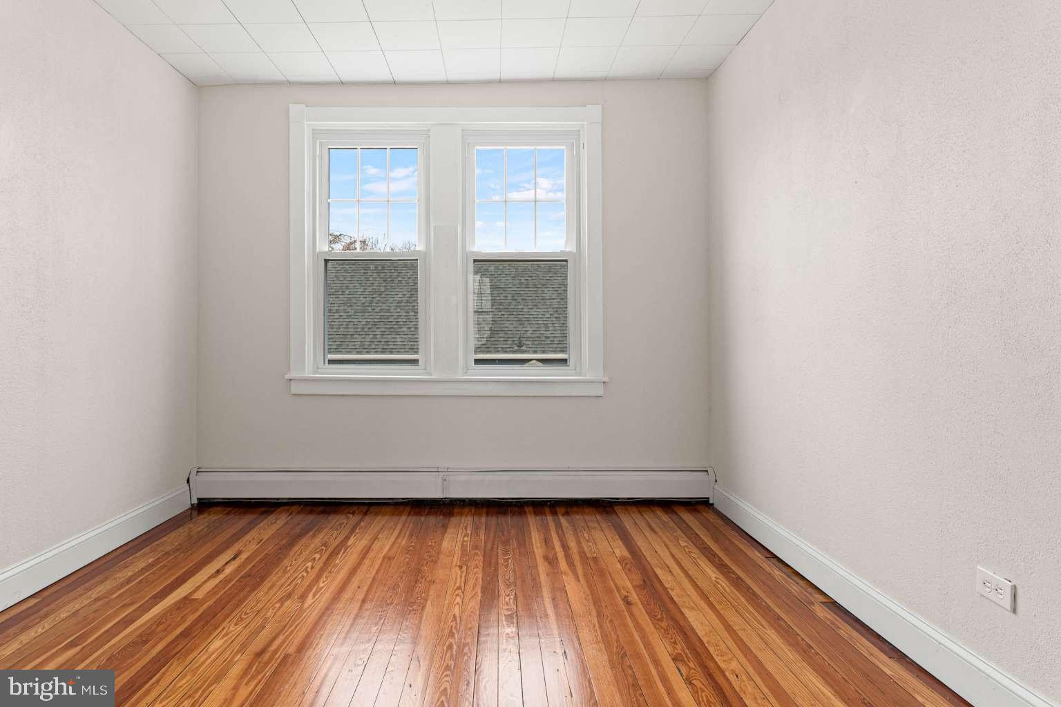 209 Willow Road Wallingford, PA 19086 - Photo 23 of 25 a view of empty room with wooden floor and fan