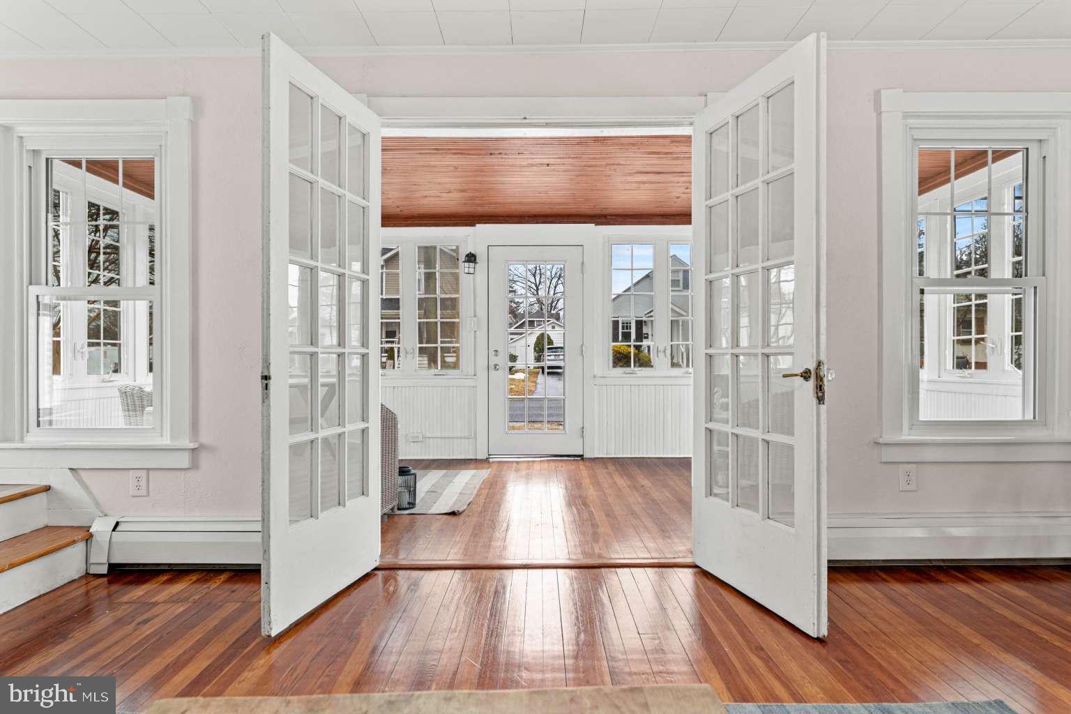 209 Willow Road Wallingford, PA 19086 - Photo 5 of 25 a view of front door with hallway and wooden floor