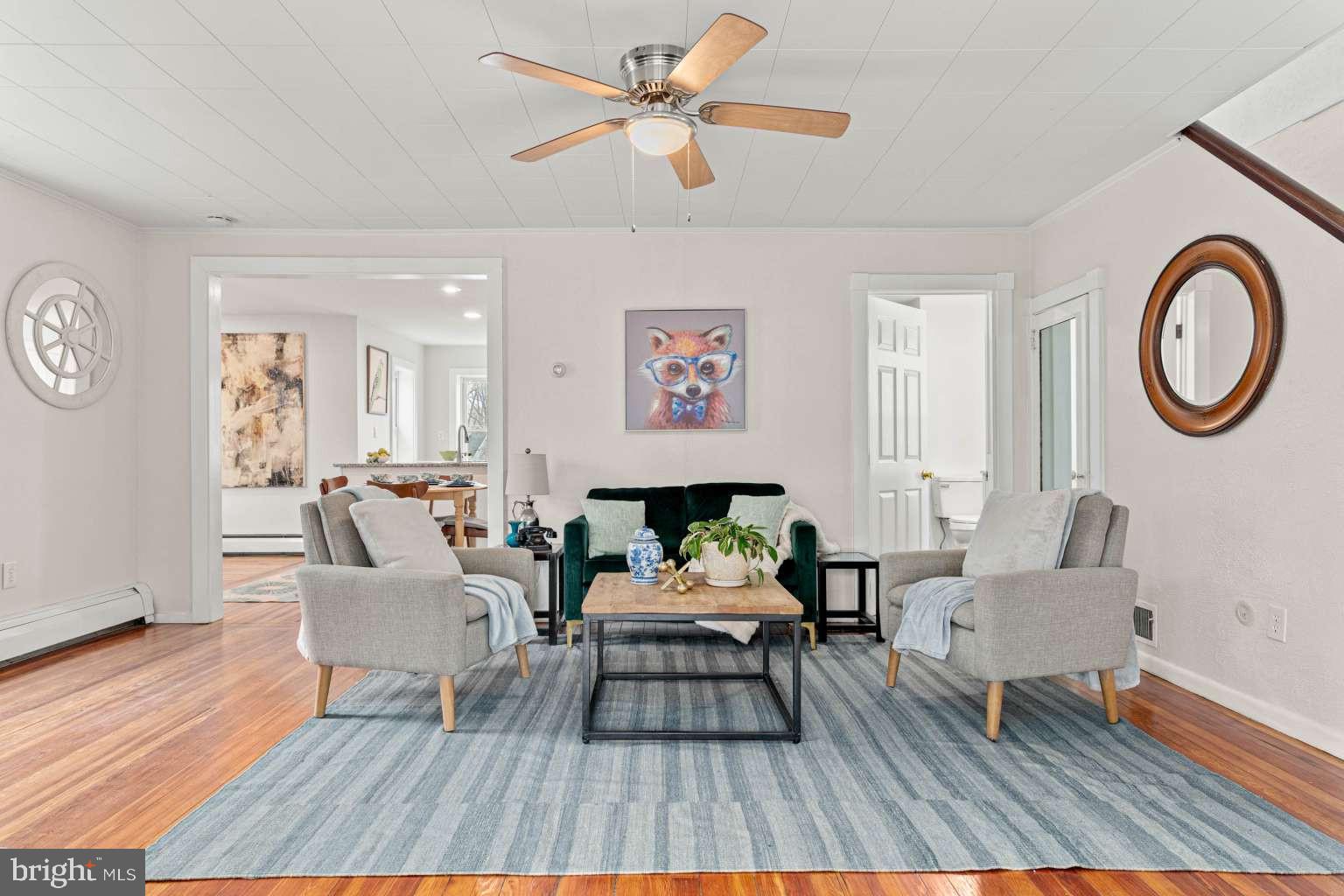 209 Willow Road Wallingford, PA 19086 - Photo 8 of 25 a living room with furniture and a wooden floor