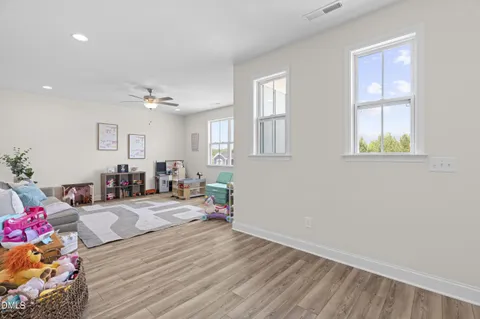 a spacious bedroom with a bed and a table in it