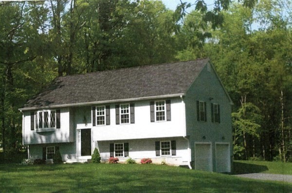 156 South Pond Road East Brookfield, MA 01515 - Photo 2 of 7 a front view of a house with a garden