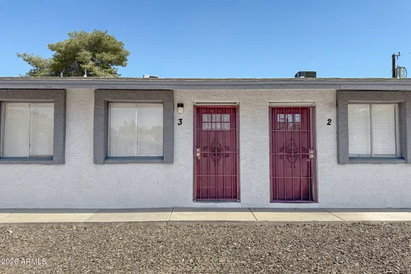 a view of a house with red door