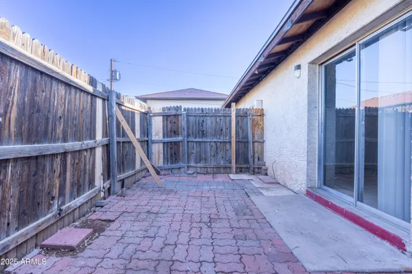 a view of a pathway with a backyard