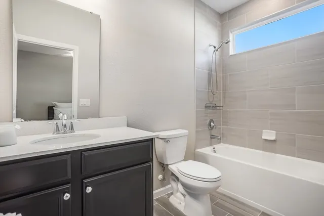 a bathroom with a sink a toilet and a bathtub