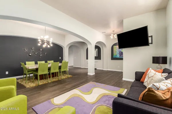 a living room with furniture fireplace and flat screen tv