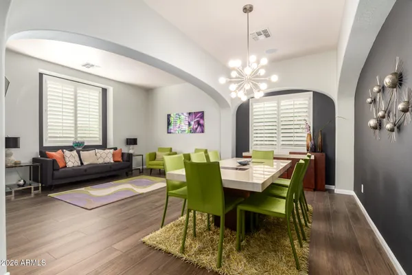 a view of a dining room with furniture window and wooden floor