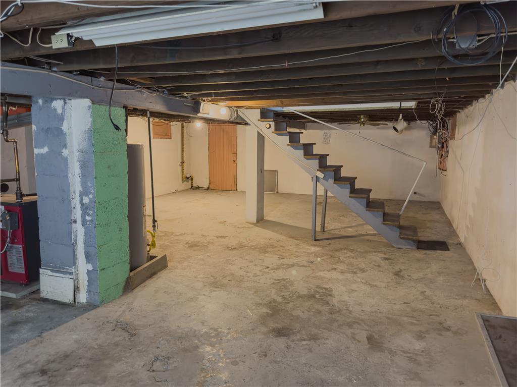 870 Chestnut Street Coplay, PA 18037 - Photo 21 of 24 Unfinished concrete floor basement offers ample utility space and direct staircase access.