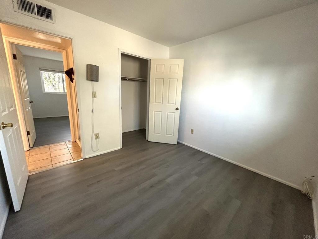 3459 El Tejon Road Borrego Springs, CA 92004 - Photo 11 of 16 an empty room with wooden floor and a window
