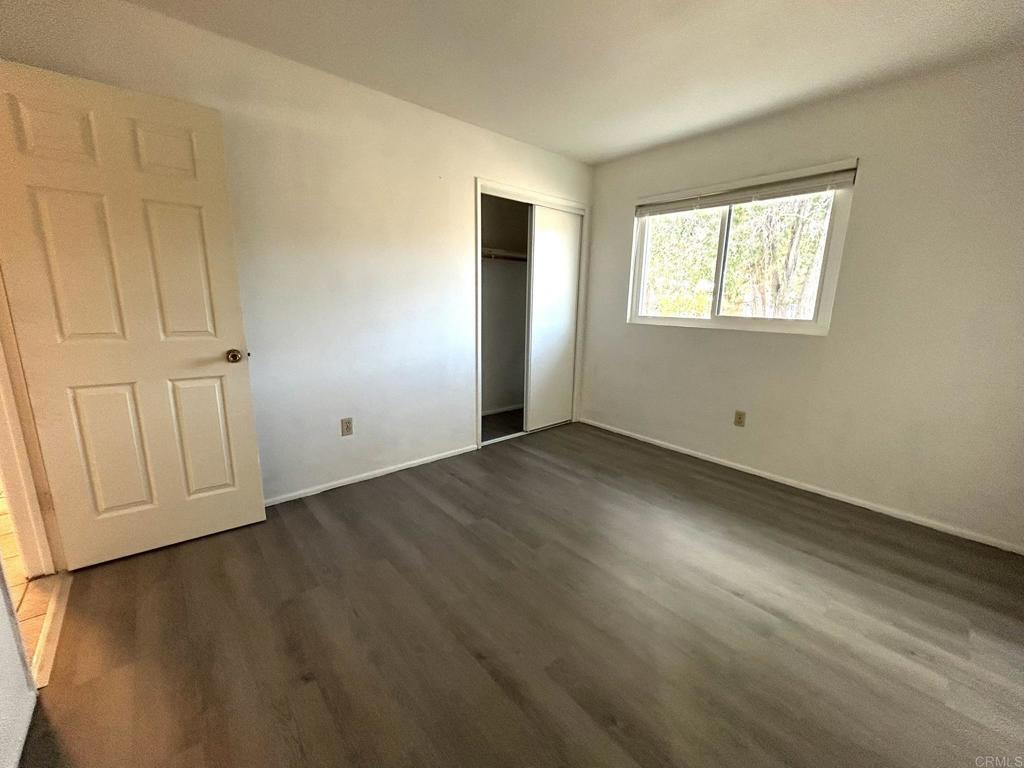 3459 El Tejon Road Borrego Springs, CA 92004 - Photo 12 of 16 a view of an empty room with wooden floor and a window