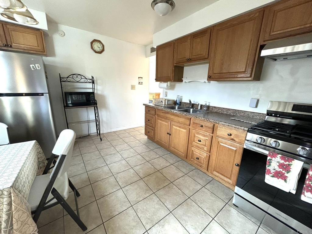3459 El Tejon Road Borrego Springs, CA 92004 - Photo 5 of 16 a kitchen with granite countertop a sink cabinets and appliances