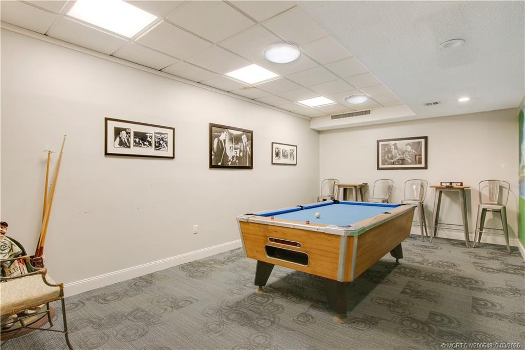 5323 Southeast Miles Grant Road, Unit 206 Stuart, FL 34997 - Photo 16 of 20 a view of a room with gym equipment