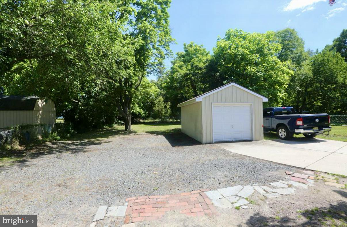 310 Ellis Street Glassboro, NJ 08028 - Photo 15 of 15 a front view of a house with a yard and garage
