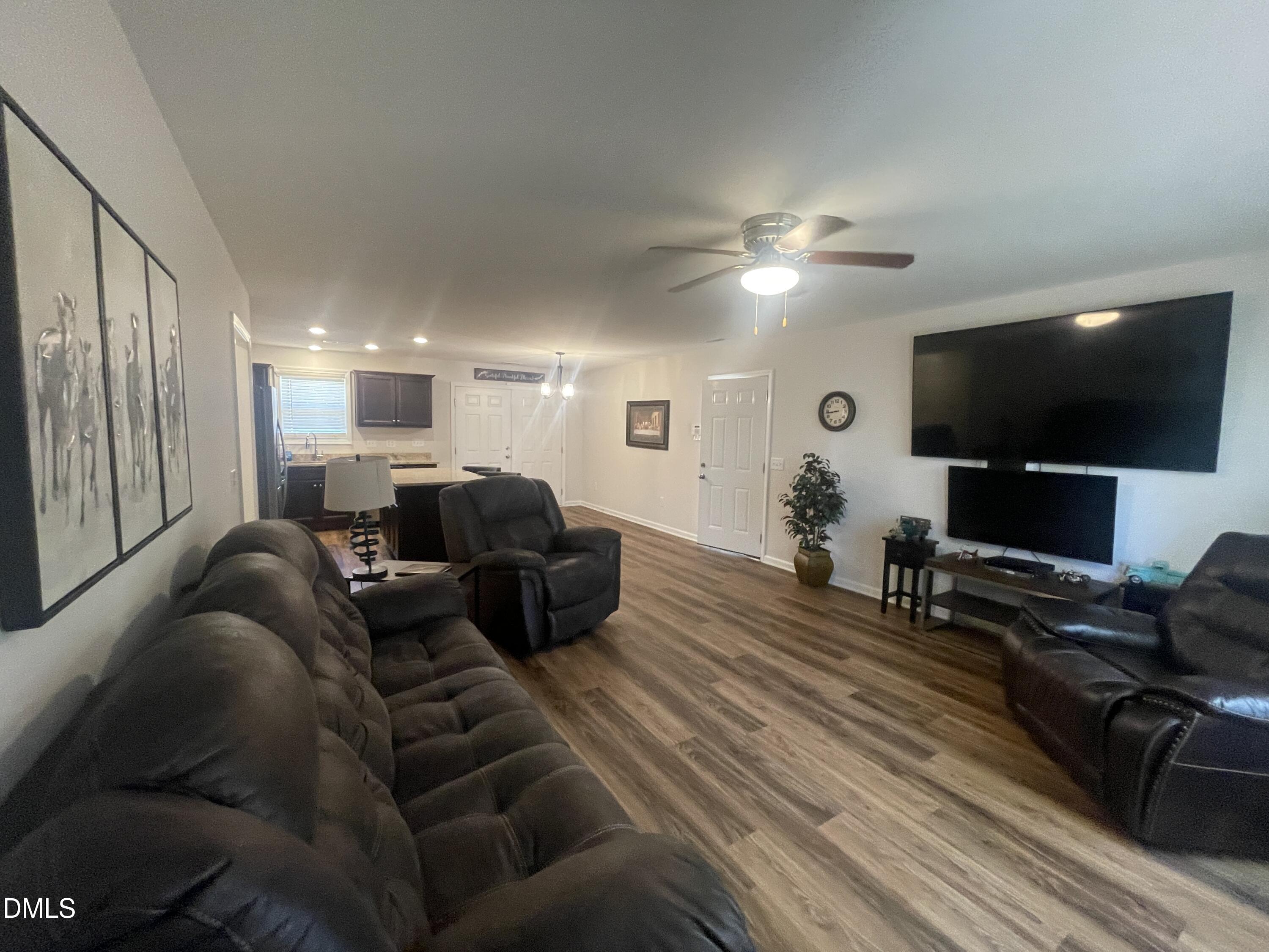 144 Red Hill Church Road Dunn, NC 28334 - Photo 12 of 44 a living room with furniture and a flat screen tv