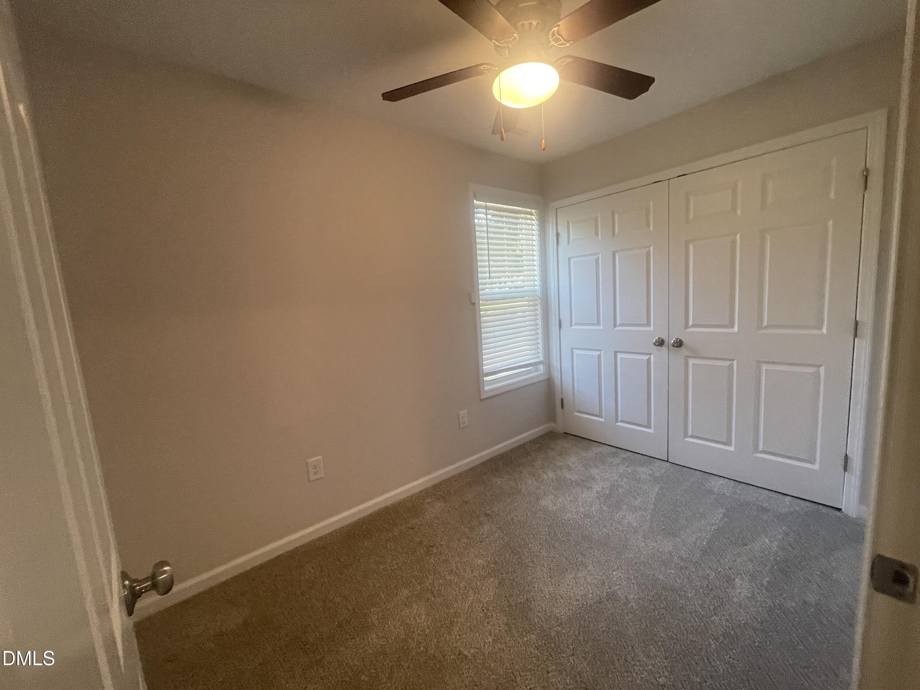 144 Red Hill Church Road Dunn, NC 28334 - Photo 14 of 44 an empty room with closet area