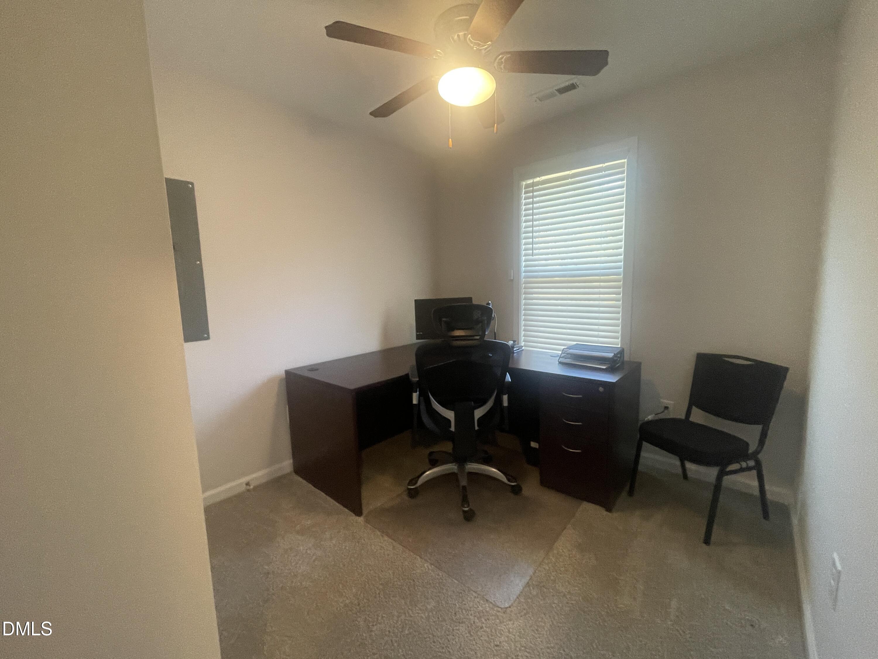 144 Red Hill Church Road Dunn, NC 28334 - Photo 17 of 44 a view of a workspace with furniture and a window