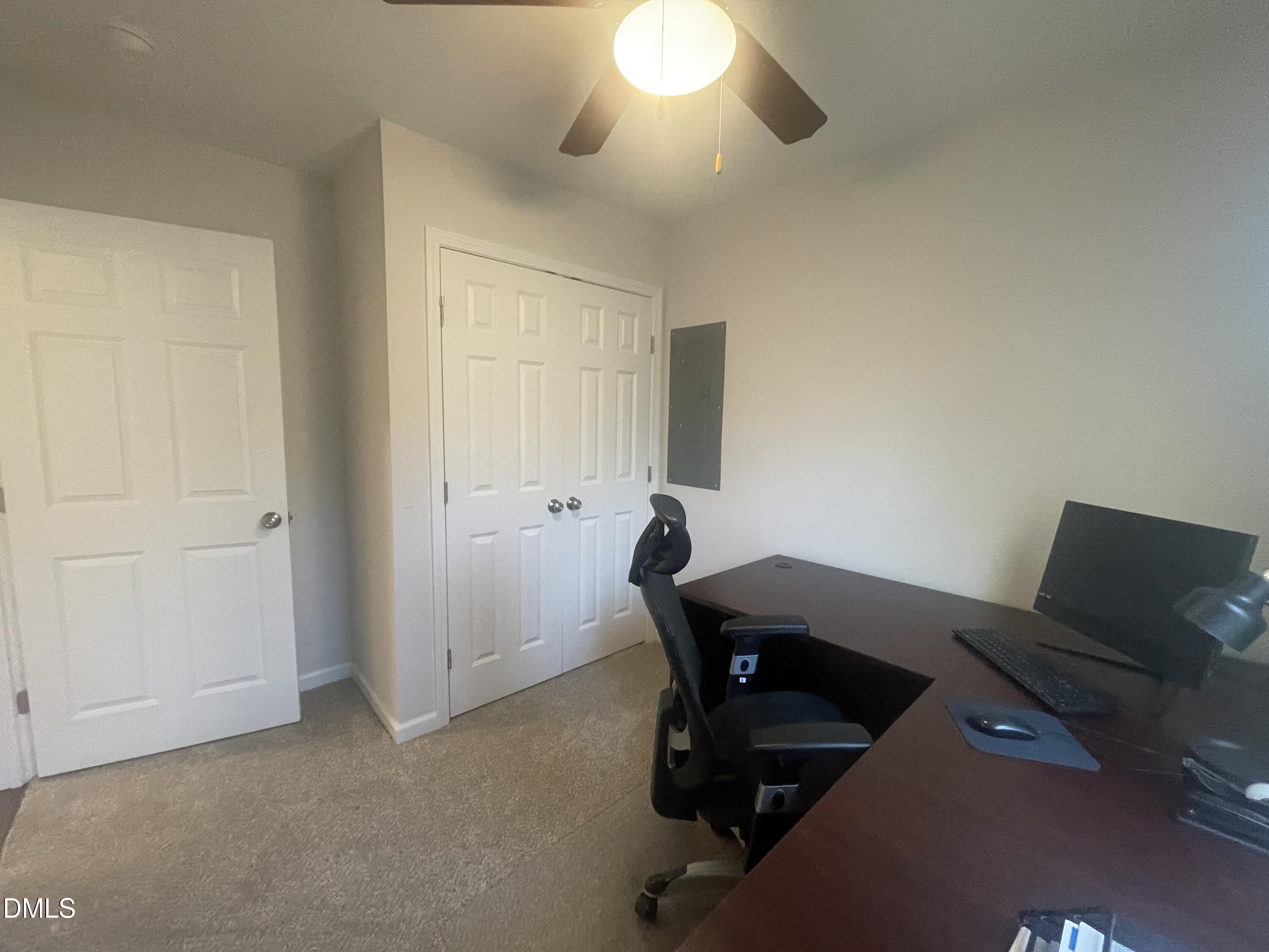 144 Red Hill Church Road Dunn, NC 28334 - Photo 18 of 44 a view of a workspace with furniture and a window