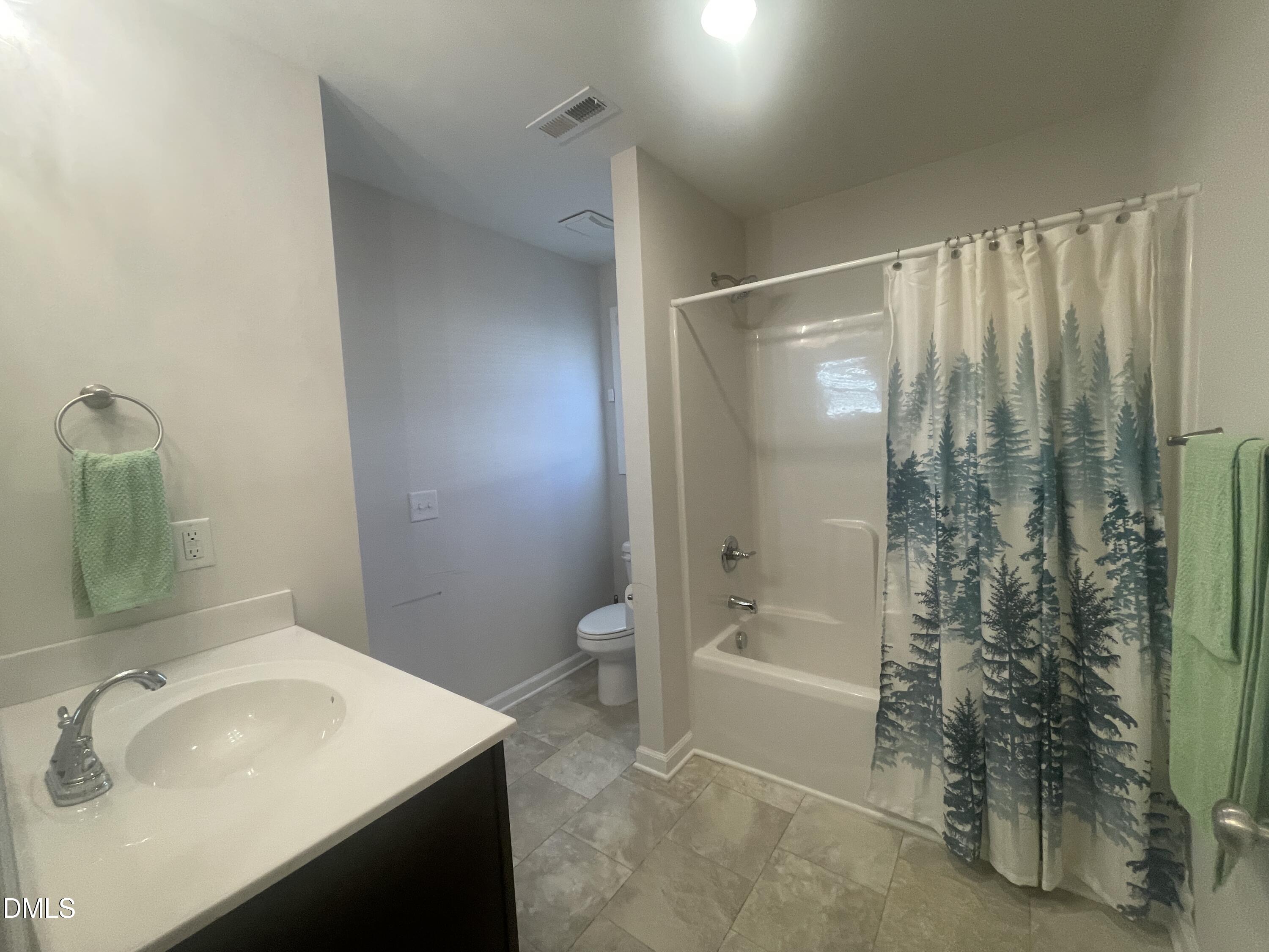 144 Red Hill Church Road Dunn, NC 28334 - Photo 21 of 44 a bathroom with a sink and a mirror