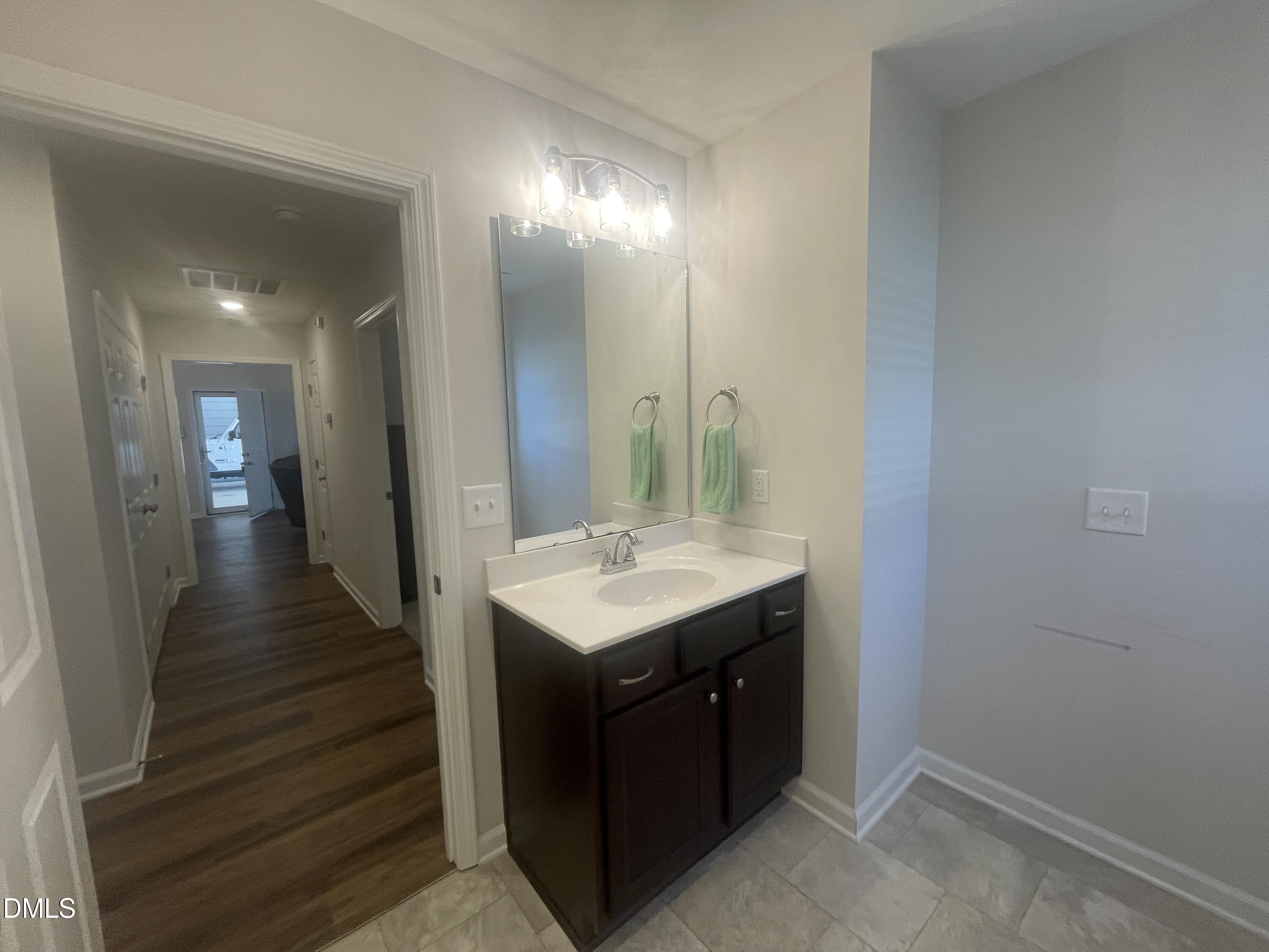144 Red Hill Church Road Dunn, NC 28334 - Photo 22 of 44 a bathroom with a sink a vanity and a mirror