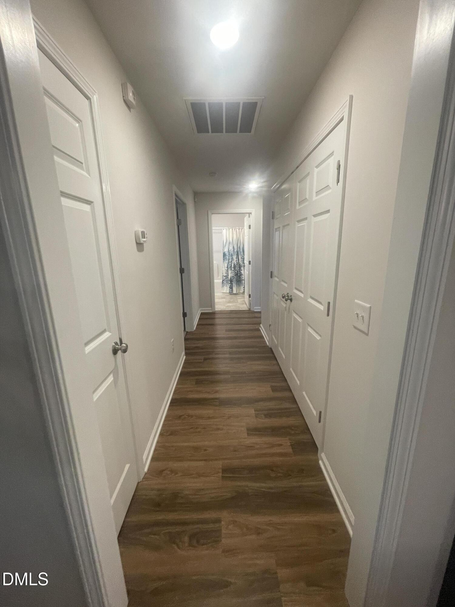 144 Red Hill Church Road Dunn, NC 28334 - Photo 23 of 44 a view of a hallway with wooden floor and staircase