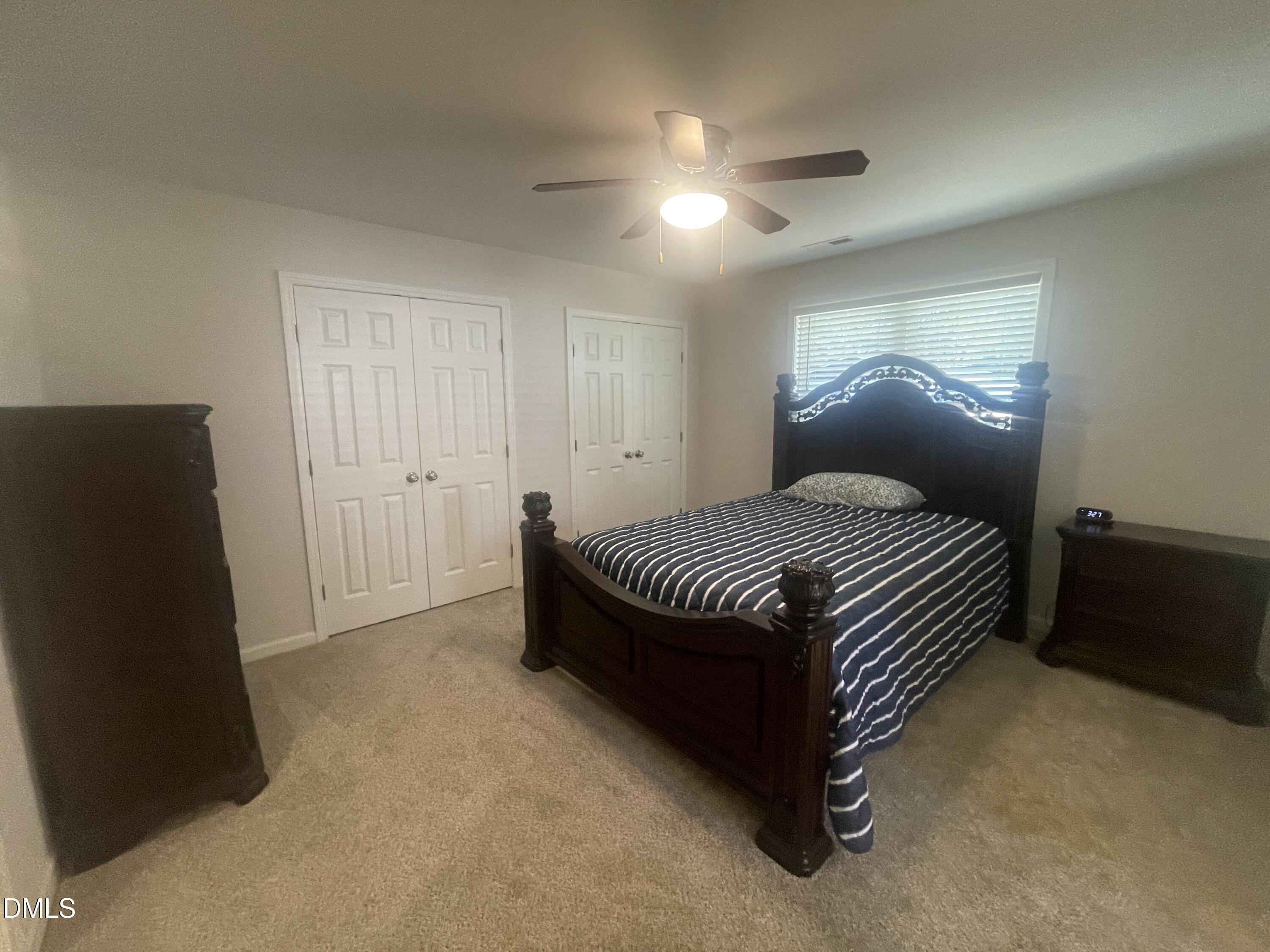 144 Red Hill Church Road Dunn, NC 28334 - Photo 25 of 44 a bedroom with a bed and dresser