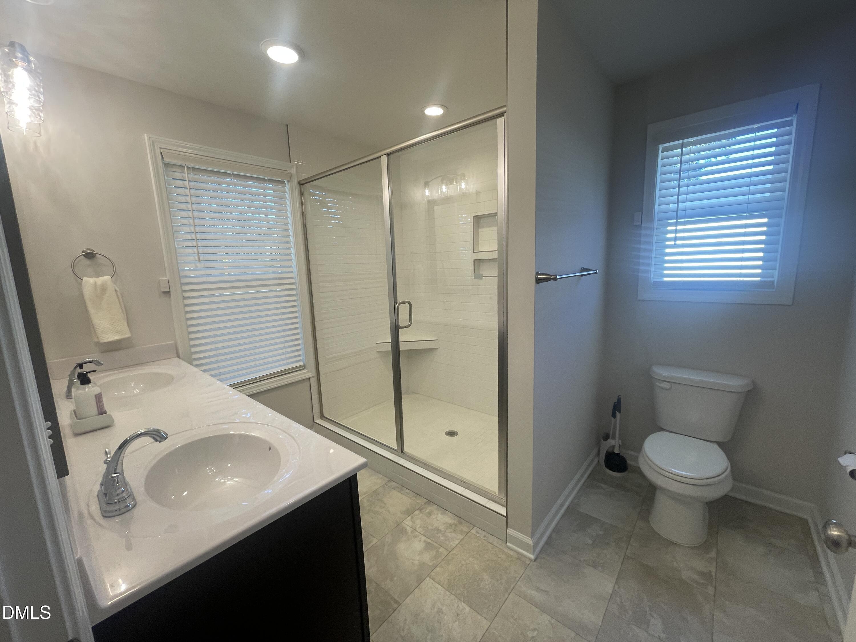 144 Red Hill Church Road Dunn, NC 28334 - Photo 28 of 44 a bathroom with a sink toilet and shower
