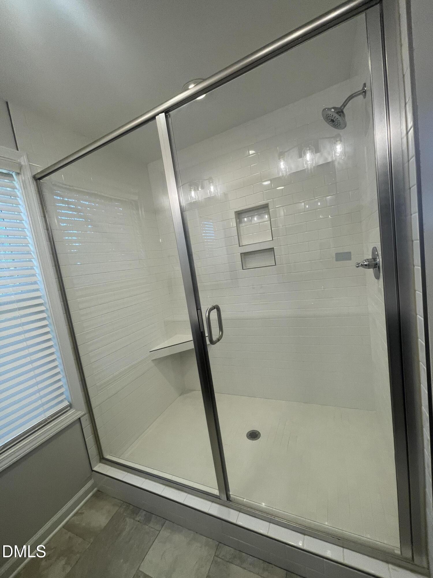 144 Red Hill Church Road Dunn, NC 28334 - Photo 30 of 44 a bathroom with a glass shower door