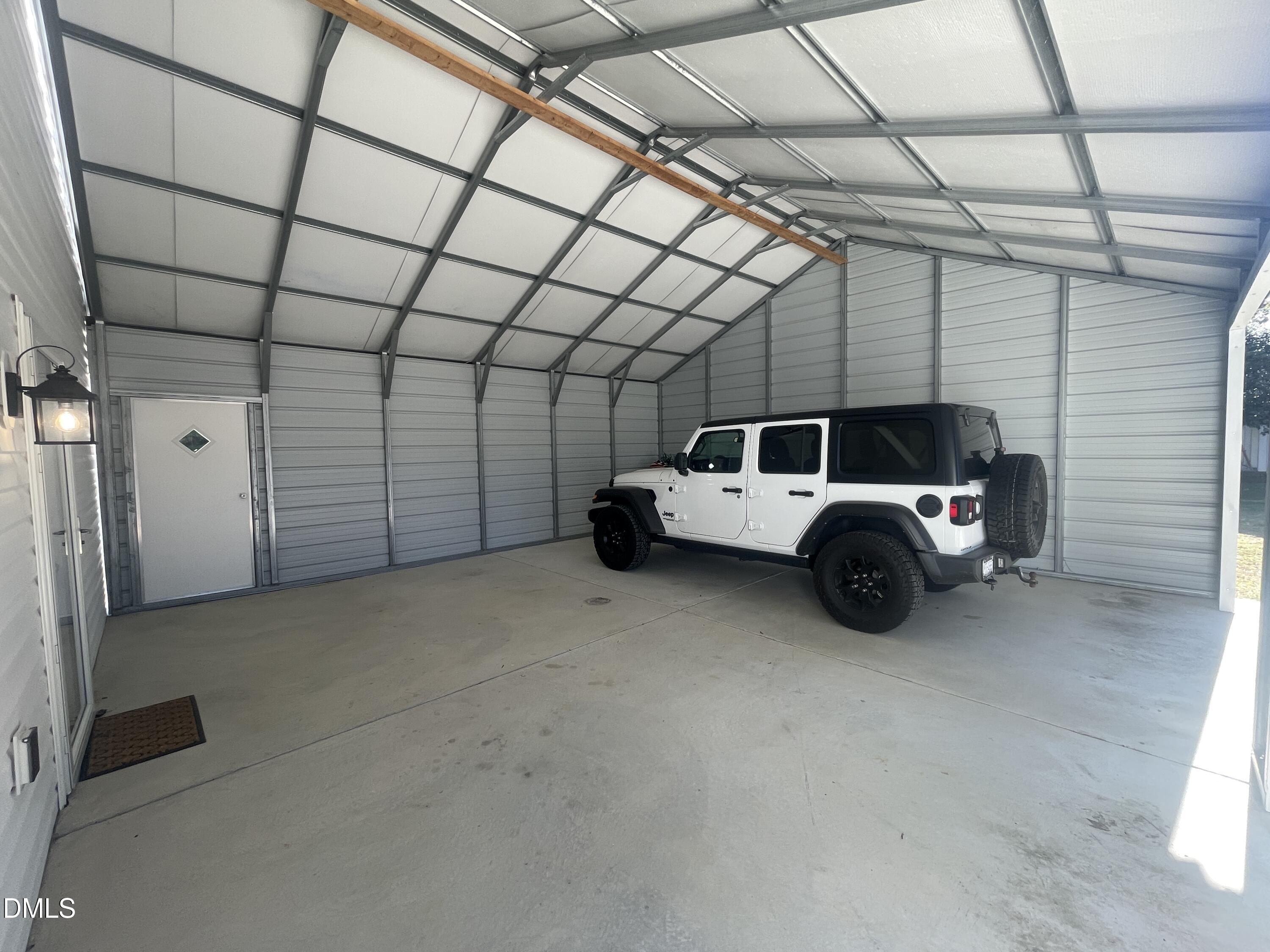 144 Red Hill Church Road Dunn, NC 28334 - Photo 32 of 44 a car parked in a garage