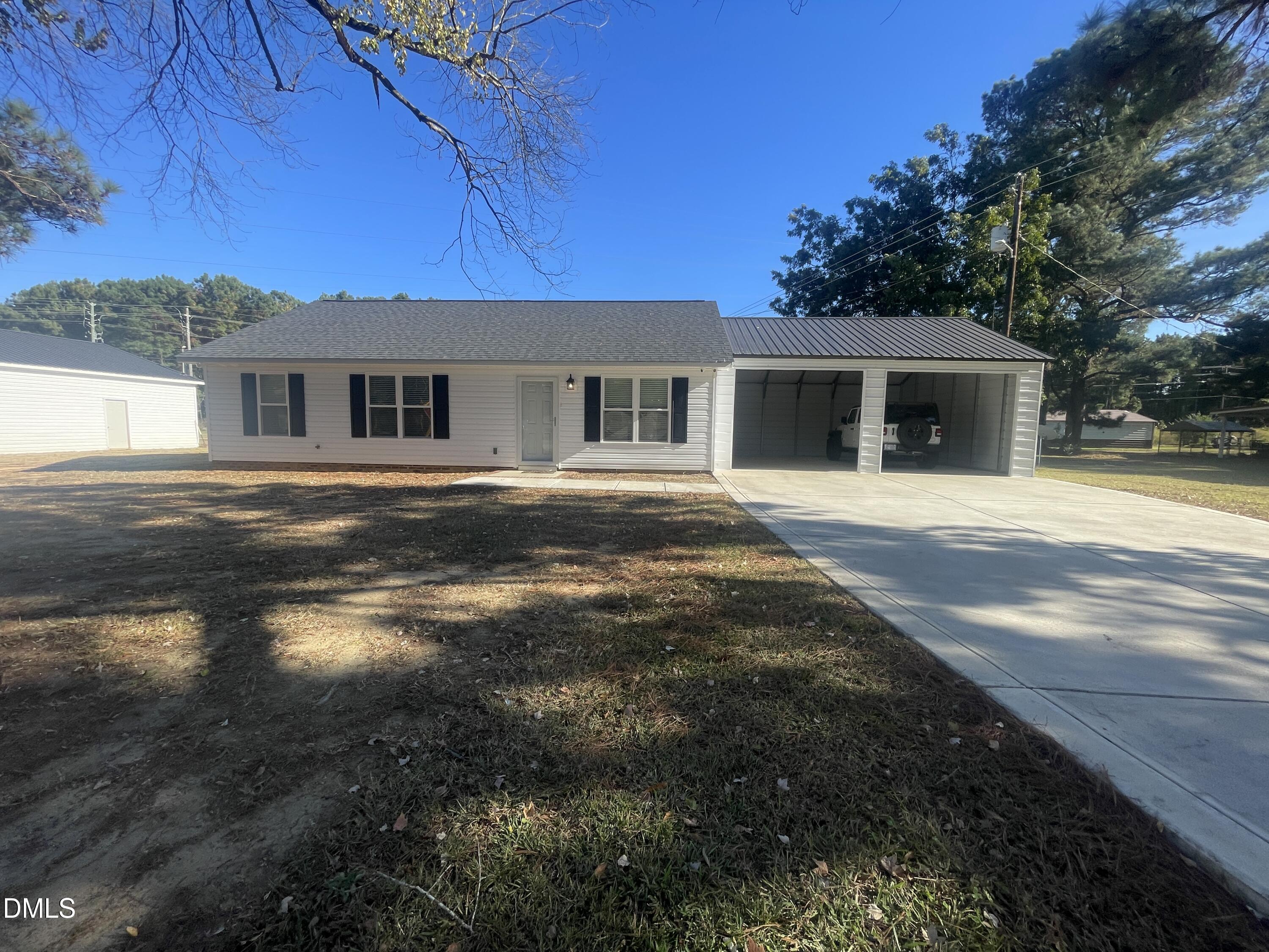 144 Red Hill Church Road Dunn, NC 28334 - Photo 33 of 44 a front view of a house with a yard